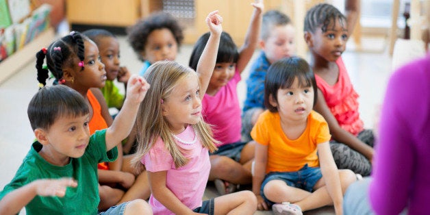 A diverse group of preschoolers in a classroom