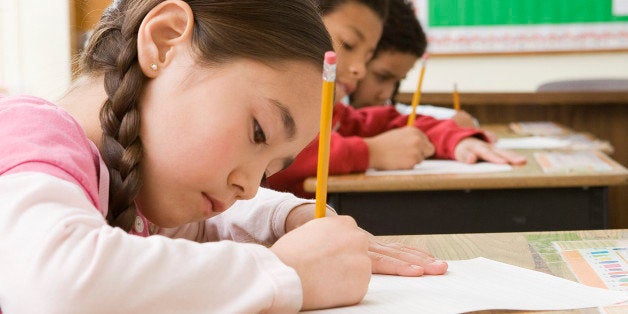 Girl doing school work in classroom