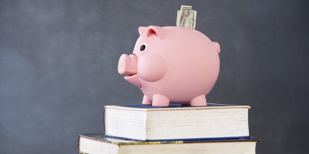 Piggy bank on stack of books