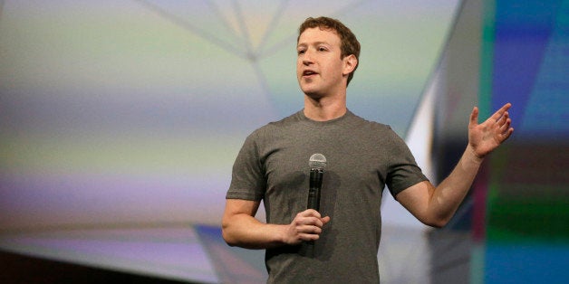 Facebook CEO Mark Zuckerberg gestures while delivering the keynote address at the f8 Facebook Developer Conference Wednesday, April 30, 2014, in San Francisco. (AP Photo/Ben Margot)