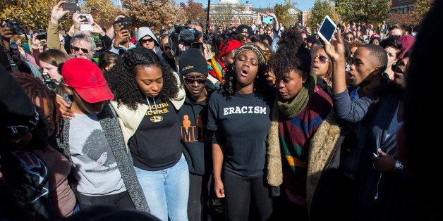 COLUMBIA, MO - NOVEMBER 9: Members of Concerned Student 1950 celebrate after the resignation of Missouri University president Timothy M. Wolfe on the Missouri University Campus November 9, 2015 in Columbia, Missouri. Wolfe resigned after pressure from students and student athletes over his perceived insensitivity to racism on the university campus. (Photo by Brian Davidson/Getty Images)