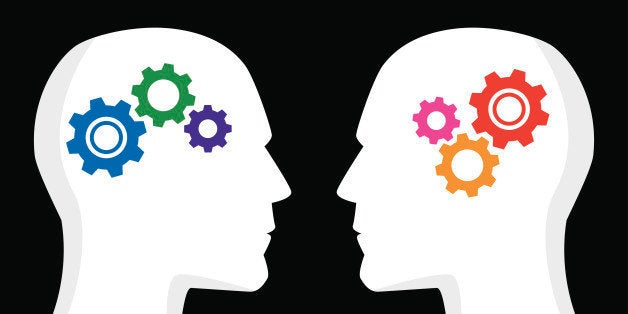 Vector illustration of two profiles with gears inside their heads. One has cool / blue colored gears, the other has hot / red colored gears.