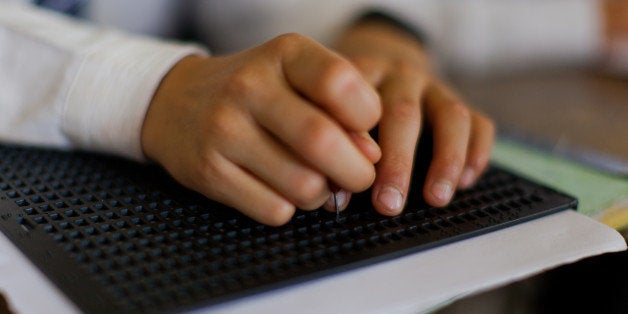 SRINAGAR, KASHMIR, INDIA - SEPTEMBER 01: A blind student learns to write Braille at Abhedananda Home, a school for deaf, mute and blind students on September 1, 2015 in Srinagar, the summer capital of Indian administered controlled Kashmir State, India. The school is having difficulty owing to a lack of funds after the government stopped grants to it. The school was established in 1941 and presently teaches 100 special needs children. It was severely damaged in last years September floods, which killed over 200 and damaged property costing billions of dollars. The government declined any help to restore the infrastructure at this school, school authorities said. Disability is an important public health problem, especially in developing countries like India where a majority of the disabled live where accessibility, availability, and utilization of rehabilitation services and its cost-effectiveness are major issues. (Photo by Yawar Nazir/Getty Images)