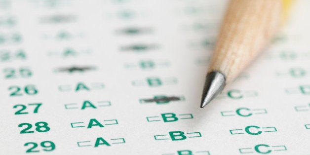 Optical scan answer sheet for school or standardized test with sharpened pencil tip.
