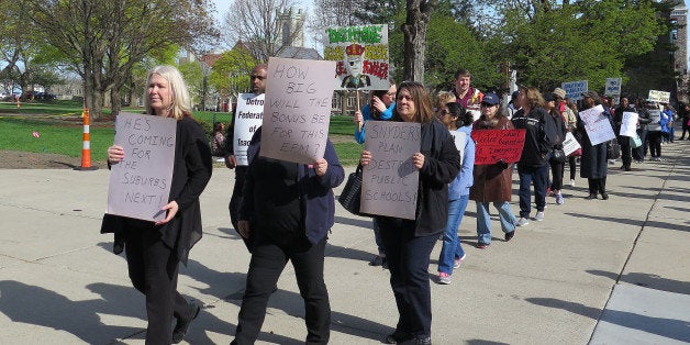 Hundreds of Detroit teachers and others protest near Gov. Rick Snyderâs office Thursday, April 30, 2015 in Lansing, Mich.