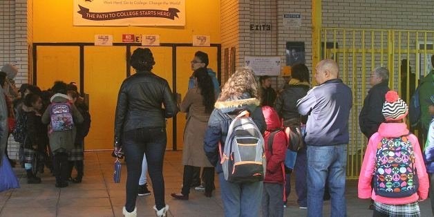 NEW YORK, NY - MARCH 9: Awaiting the opening of the school and the start of a school day, students gather in front of NYC charter school Democracy Prep Harlem Elementary which is housed in the former Choir Academy of Harlem building and where homeless sleep on school grounds in New York, New York on March 9, 2016. Photo Credit: Rainmaker Photo/MediaPunch/IPX