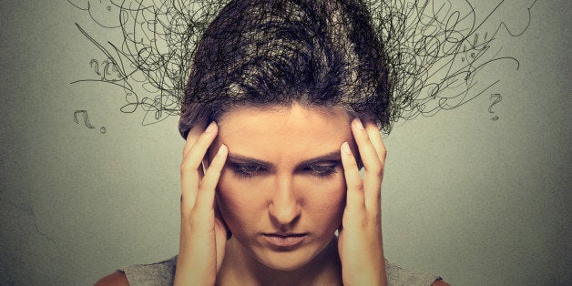 Closeup sad young woman with worried stressed face expression and brain melting into lines question marks. Obsessive compulsi
