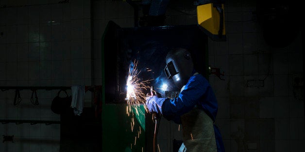 A student attends a welding class during vocational training at the Infrastructure Leasing & Financial Services (IL&FS) Institute of Skills in New Delhi, India, on Thursday, June 25, 2015. Prime Minister Narendra Modi is racing to change a skills shortage that affects professions across India, from truck drivers and cooks to engineers and airline technicians. About 5 percent of Indian workers have had formal skills training, compared with 96 percent in South Korea and 80 percent in Japan. Photograph: Udit Kulshrestha/Bloomberg via Getty Images