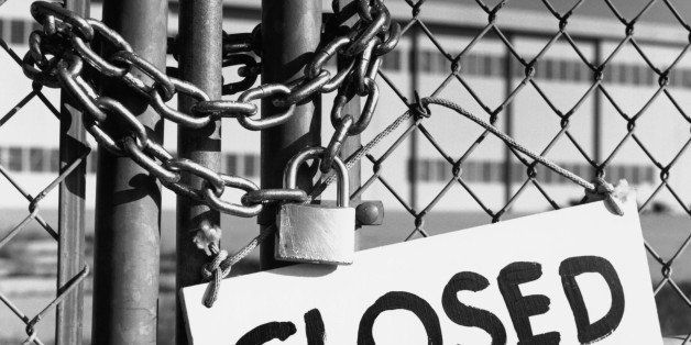 Closed sign on chain link fence, close-up (B&W)