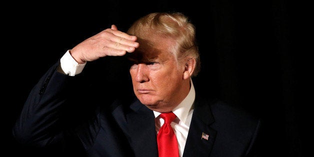 Republican presidential nominee Donald Trump listens to a question as he appears at the "Retired American Warriors" conference during a campaign stop in Herndon, Virginia, U.S., October 3, 2016. REUTERS/Mike Segar