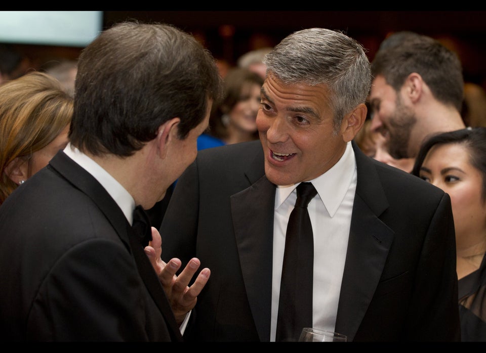 Actor George Clooney speaks with Chris W