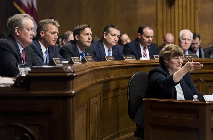 The Republican members of the Senate Judiciary Committee -- all white men -- listen to prosecutor Rachel Mitchell question Christine Blasey Ford for them.