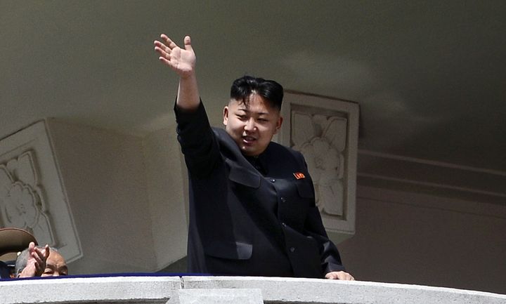 North Korea's leader Kim Jong-Un waves at the end of a major military parade to mark 100 years since the birth of the country's founder and his grandfather, Kim Il-Sung, in Pyongyang on April 15, 2012. The commemorations came just two days after a satellite launch timed to mark the centenary fizzled out embarrassingly when the rocket apparently exploded within minutes of blastoff and plunged into the sea. AFP PHOTO / PEDRO UGARTE (Photo credit should read PEDRO UGARTE/AFP/Getty Images)