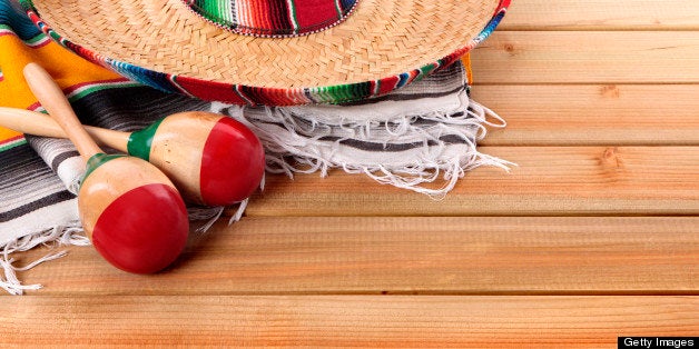 Mexican serape rug, sombrero and maracas