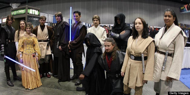 Los Angeles, UNITED STATES: Star Wars fans pose for a photo during the opening day of 'Star Wars Celebration IV' in Los Angeles 24 May 2007. The five-day convention celebrates the 30th anniversary of the Star Wars saga. AFP PHOTO/GABRIEL BOUYS (Photo credit should read GABRIEL BOUYS/AFP/Getty Images)