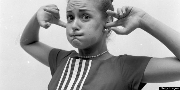 circa 1955: Holding a mouth full of air and plugging up the ears is another method for stopping an attack of hiccups. (Photo by Three Lions/Getty Images)