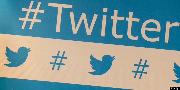 TO GO WITH AFP STORY BY NATALIA RAMOS Twitter's brand marks are seen as background of the speakers during their press confere