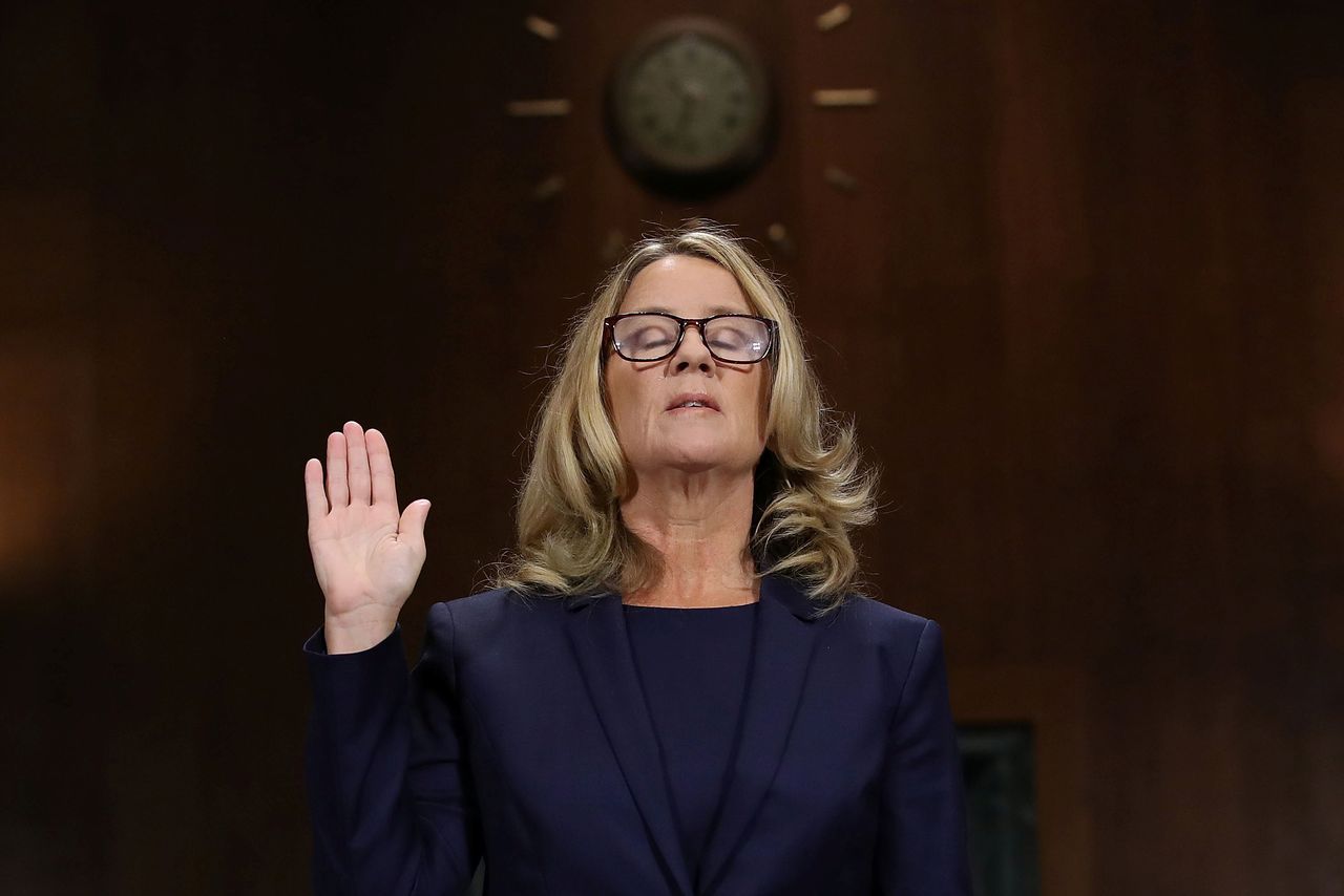 Christine Blasey Ford is sworn in before testifying.