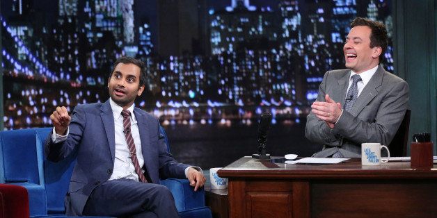 LATE NIGHT WITH JIMMY FALLON -- Episode 918 -- Pictured: (l-r) Aziz Ansari with host Jimmy Fallon during an interview on Wednesday, October 30, 2013 -- (Photo by: Lloyd Bishop/NBC/NBCU Photo Bank via Getty Images)