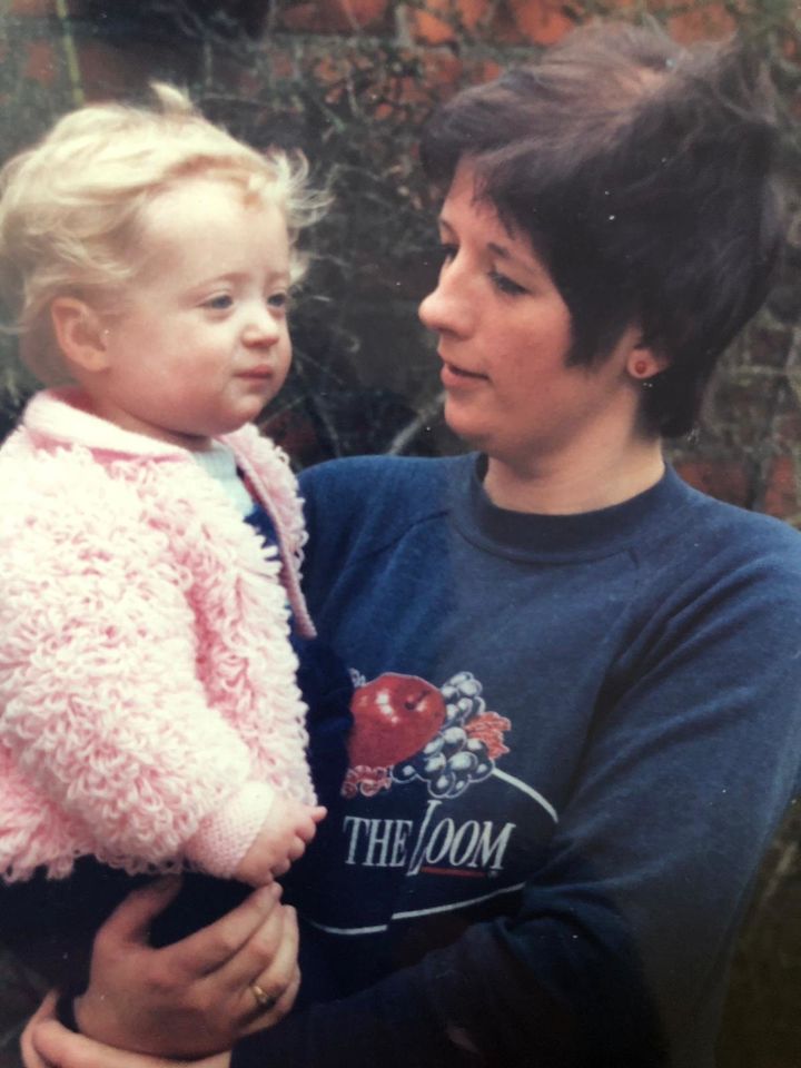 Lauren's mother Barbara Palmer holding her as a toddler