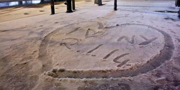 NEW YORK, NY - JANUARY 2: 'I love New York 2.1.14' is stenciled into the snow during winter storm 'Hercules' in lower Manhat