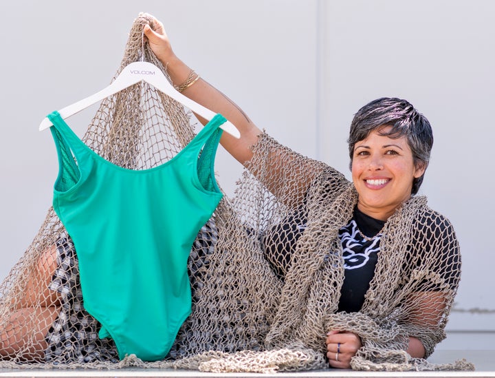 Marina Hamm, a designer and merchandiser for Volcom, displays one of the brand's bathing suits made from recycled fishing nets.