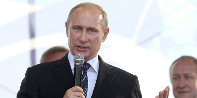 SOCHI, RUSSIA - MAY 15: Russian President Vladimir Putin greets participants of SCF Black Sea Tall Ships Regatta on May 15, 2014 in Sochi, Russia. Putin is having a one-week trip to Sochi. (Photo by Sasha Mordovets/Getty Images)