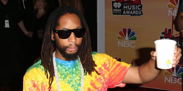 LOS ANGELES, CA - MAY 01: Rapper Lil Jon toast the press during the 2014 iHeartRadio Music Awards at The Shrine Auditorium on May 1, 2014 in Los Angeles, California. (Photo by Frederick M. Brown/Getty Images)