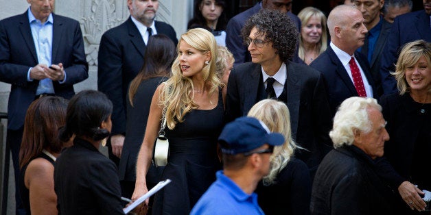 Howard Stern, center right, and his wife Beth depart a funeral service for comedian Joan Rivers at Temple Emanu-El in New York Sunday, Sept. 7, 2014. Rivers died Thursday at 81. (AP Photo/Craig Ruttle)