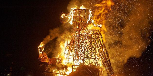 BRECON, UNITED KINGDOM - AUGUST 17: The Green Man sculpture is set alight during the final day of Green Man Festival at Glanusk Park on August 17, 2014 in Brecon, United Kingdom. (Photo by Gary Wolstenholme/Redferns via Getty Images)