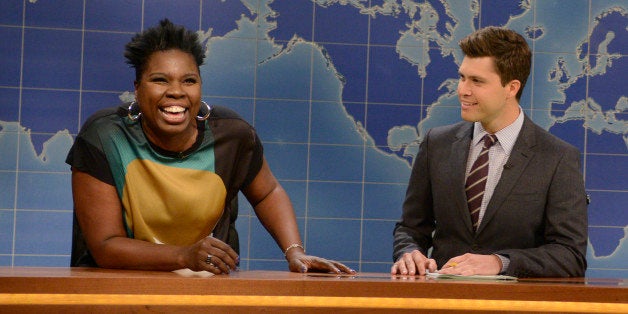 SATURDAY NIGHT LIVE -- 'Chris Pratt' Episode 1663 -- Pictured: (l-r) Relationship expert Leslie Jones, Colin Jost and Michael Che during the 'Weekend Update' skit on September 27, 2014 -- (Photo by: Dana Edelson/NBC/NBCU Photo Bank via Getty Images)