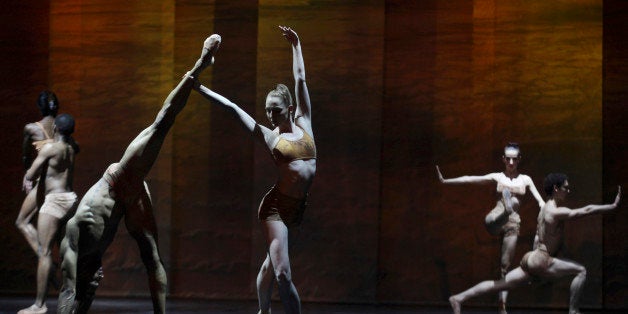 In this photo taken Thursday, Sept. 18 2014, dancers of the Joburg Ballet take part in The Nutcracker Re-imagined dress rehearsal , in Johannesburg,South Africa, ahead of five performance to be performed starting Friday, Sept 19, 2014. The production includes acrobatics and African themes added to give local flavor such as gumboot dancing. (AP Photo/Denis Farrell)