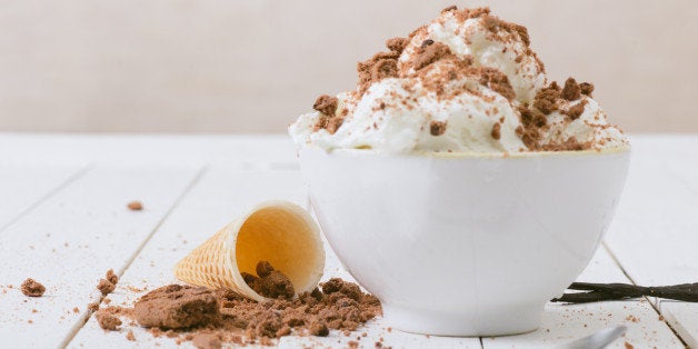 Vanilla Ice Cream on the white wooden table.