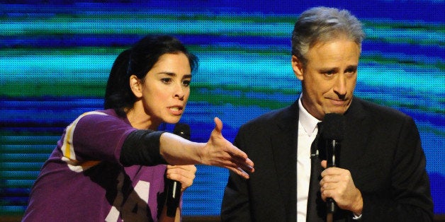 NEW YORK, NY - FEBRUARY 28: Sarah Silverman (L) and Jon Stewart perform on stage at Comedy Central's 'Night of Too Many Stars: America Comes Together For Autism Programs' on February 28, 2015 in New York City. (Photo by Andrew Toth/FilmMagic)