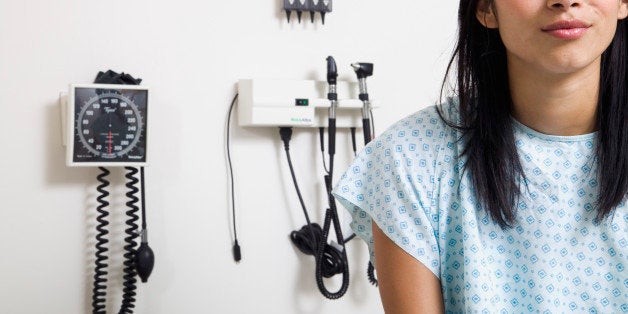 Portrait of a young woman sitting in a doctor's office