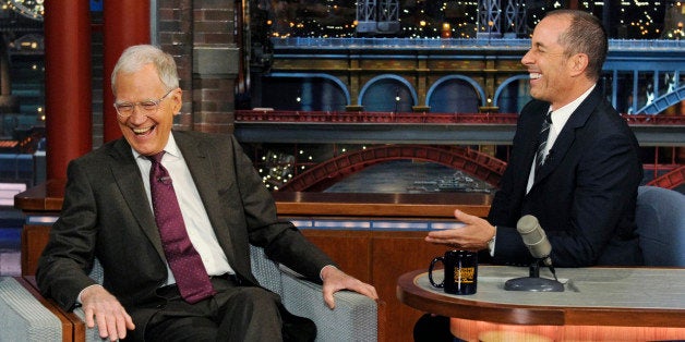 In this photo provided by CBS, host David Letterman, left, sits in the guestâs chair as comedian Jerry Seinfield sits at Le