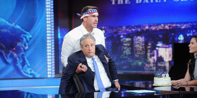 NEW YORK, NY - AUGUST 06: Host Jon Stewart, Rob Riggle and Olivia Munn appear on 'The Daily Show with Jon Stewart' #JonVoyag