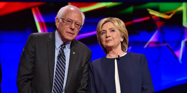 Democratic presidential candidates Sen. Bernie Sanders, of Vermont, left, and Hillary Rodham Clinton talk before the CNN Dem