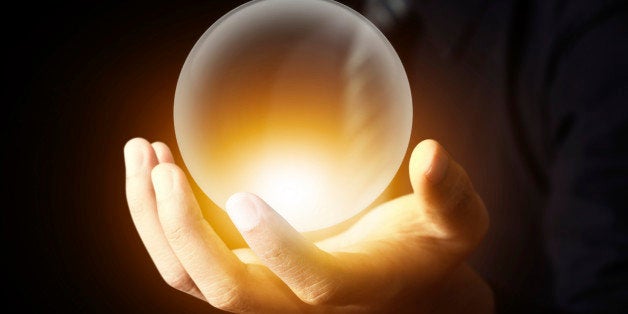 Businessman hand holding a Crystal Ball