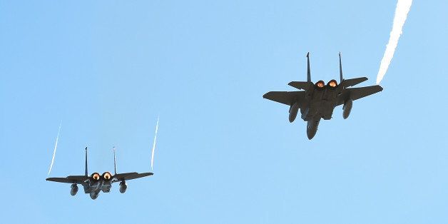LAS VEGAS, NV - DECEMBER 19: A pair of F-15C fighter jets from Nellis Air Force Base perform a flyover before the Brigham Young Cougars and Utah Utes play in the Royal Purple Las Vegas Bowl at Sam Boyd Stadium on December 19, 2015 in Las Vegas, Nevada. Utah won 35-28. (Photo by Ethan Miller/Getty Images)