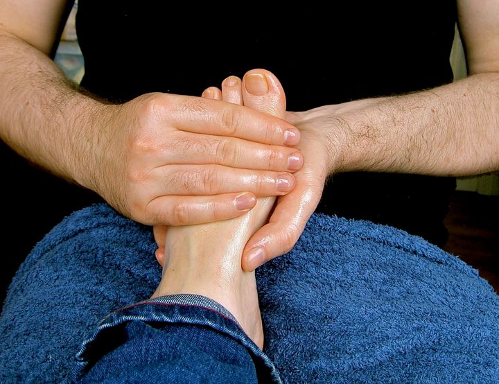Description 1 Photograph of a man massaging a woman's foot using baby oil as a lubricant. The foot is mine and the massaging hands are my ... 