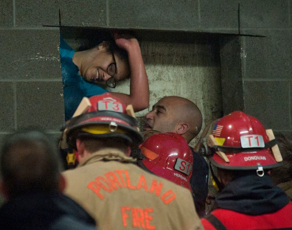 Firefighters rescue woman trapped in a wall