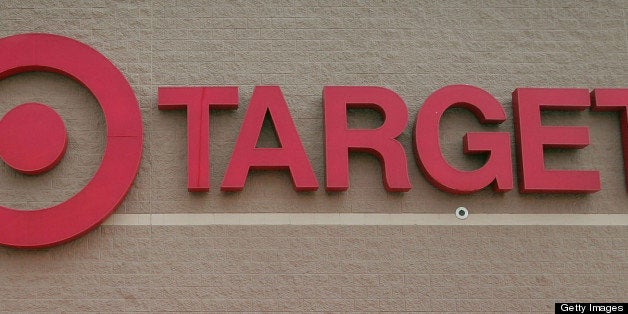 CHICAGO - MAY 23: A bicyclist rides past a row of shopping carts outside a Target store on May 23, 2007 in Chicago, Illinois
