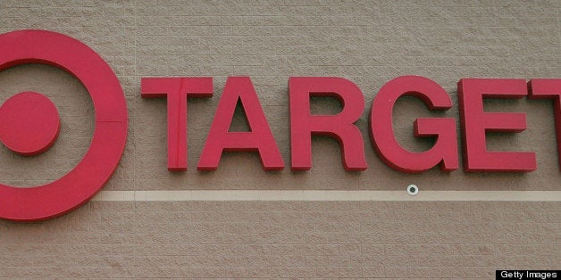 CHICAGO - MAY 23: A bicyclist rides past a row of shopping carts outside a Target store on May 23, 2007 in Chicago, Illinois. Today, Target reported an 18 per cent increase in their quarterly earnings, beating analysts' expectations. (Photo by Scott Olson/Getty Images)