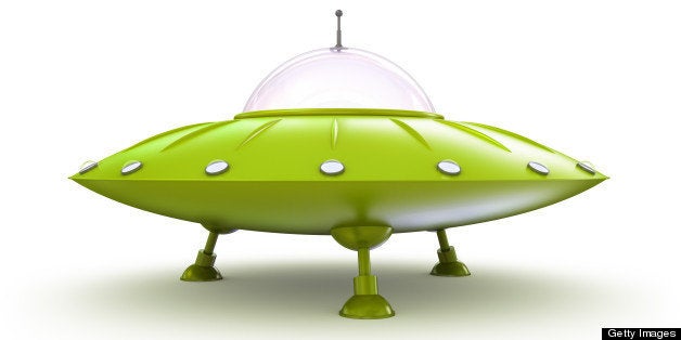 Green flying saucer isolated on white.