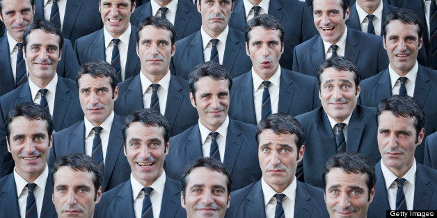 Crowd of businessmen with multiple expressions