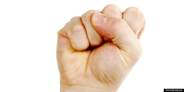 a male fist in the air isolated ...