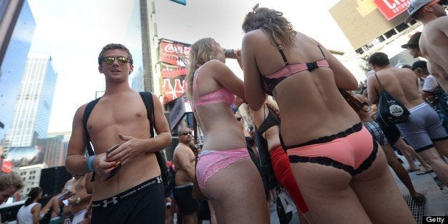 People assemble on Times Square in New York on August 5, 2013 in an attempt to break the Guiness World Record of people gathered in their underwear. The current record is of 2,270 people. AFP PHOTO/Emmanuel Dunand (Photo credit should read EMMANUEL DUNAND/AFP/Getty Images)