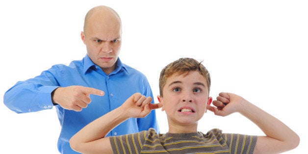 strict father punishes his son. ...