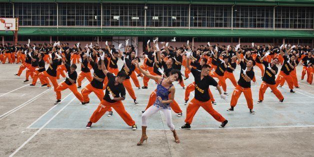 CEBU, PHILIPPINES - JUNE 26: Inmates of the CPDRC prison perform Michael Jackson's Thriller June 26, 2010 in Cebu, Philippines. Byron F. Garcia is the man behind the The Ambassadors of Goodwill, ex- prisoners who dance, who gained fame locally and on Youtube re-enacting Michael Jackson's Thriller dance while still in prison. Byron Garcia started the dancing in a local prison (Cebu Provincial Detention and Rehabilitation Center also known by its initials CPDRC) working there as a security consultant. After allegedly embezzling donation money, Garcia left the prison but has started his own dancing troupe with ex-prisoners, some of whom he has helped getting out of prison. (Photo by David Hogsholt/Getty Images)